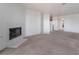 Large living room with a fireplace, neutral paint, and carpet at 5046 S Rainbow Blvd # 103, Las Vegas, NV 89118