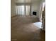 Living room with fireplace and access to patio at 5046 S Rainbow Blvd # 103, Las Vegas, NV 89118