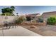 Charming backyard with patio seating, gravel, and rock landscaping at 5448 Red Sun Dr, Las Vegas, NV 89149