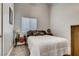 Cozy bedroom with a double bed, window, and bedside table at 5448 Red Sun Dr, Las Vegas, NV 89149