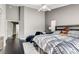 Main bedroom with dark wood furniture, plush bedding, and ceiling fan at 5448 Red Sun Dr, Las Vegas, NV 89149