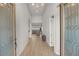 Bright and airy entryway with wood-look floors and glass doors at 5860 Noah Springs Ct, Las Vegas, NV 89149