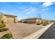 Spacious three-car garage with paver driveway at 5860 Noah Springs Ct, Las Vegas, NV 89149