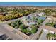 Aerial view showcasing house, expansive yard, tennis court, and mountain views at 5880 W Oquendo Rd, Las Vegas, NV 89118