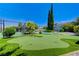 Large backyard with pool, putting green, and tennis court at 5880 W Oquendo Rd, Las Vegas, NV 89118