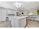 Open concept kitchen with large island and breakfast bar seating at 5880 W Oquendo Rd, Las Vegas, NV 89118