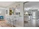 Kitchen with breakfast bar, white cabinets, and open layout at 5880 W Oquendo Rd, Las Vegas, NV 89118