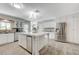 Spacious kitchen with island, stainless steel appliances, and white shaker cabinets at 5880 W Oquendo Rd, Las Vegas, NV 89118