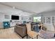 Bright and airy living room with hardwood floors and ample seating at 5880 W Oquendo Rd, Las Vegas, NV 89118