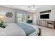 King-size bed, en-suite bathroom, and access to the backyard at 5880 W Oquendo Rd, Las Vegas, NV 89118