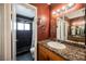 Bathroom with a dark vanity, granite countertop and a shower/tub combo at 6232 Lanning Ln, Las Vegas, NV 89108