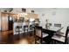 Dining area with a dark wood table and chairs, adjacent to the kitchen at 6232 Lanning Ln, Las Vegas, NV 89108