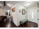 Home entryway with wood-look flooring, a bench, and framed wall art at 6232 Lanning Ln, Las Vegas, NV 89108