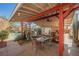 Covered patio with outdoor dining furniture and pool view at 6232 Lanning Ln, Las Vegas, NV 89108