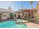 Private backyard with a large pool, spa, and covered patio at 6232 Lanning Ln, Las Vegas, NV 89108