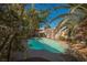 Refreshing pool with a large spa, surrounded by lush landscaping at 6232 Lanning Ln, Las Vegas, NV 89108