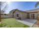 Artificial turf backyard with patio and neighbor's house visible at 6232 Novak St, Las Vegas, NV 89115