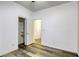 Bedroom with wood-look floors and mirrored closet doors at 6232 Novak St, Las Vegas, NV 89115