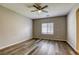 Spacious bedroom with wood-look flooring and ceiling fan at 6232 Novak St, Las Vegas, NV 89115