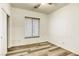 Bright bedroom with wood-look floors and a window at 6232 Novak St, Las Vegas, NV 89115