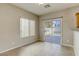 Dining area with tile floors and sliding door to patio at 6232 Novak St, Las Vegas, NV 89115