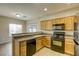 Inviting kitchen with stainless steel appliances and rich wood cabinets at 6232 Novak St, Las Vegas, NV 89115