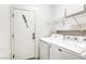 Laundry room with washer, dryer, and shelving at 6232 Novak St, Las Vegas, NV 89115