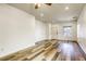 Bright living room with wood-look floors and ceiling fan at 6232 Novak St, Las Vegas, NV 89115