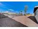 Spacious backyard with gravel and mature tree at 6252 Fairwood Ave, Las Vegas, NV 89107