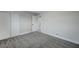 Well-lit bedroom featuring grey carpet and double doors at 6252 Fairwood Ave, Las Vegas, NV 89107