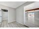 Modern hallway with vinyl flooring, and view into living room at 6252 Fairwood Ave, Las Vegas, NV 89107