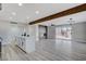 Open concept kitchen with white cabinets and a center island at 6252 Fairwood Ave, Las Vegas, NV 89107