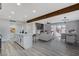 Modern kitchen with white cabinets, quartz countertops, and island at 6252 Fairwood Ave, Las Vegas, NV 89107