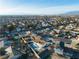 A high-angle aerial view showing a house with a pool and a covered patio in a densely populated neighborhood at 6255 Adenmoor Ct, Las Vegas, NV 89156