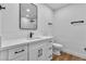 Modern bathroom featuring a vanity with a vessel sink, a sleek mirror, and neutral tones at 6255 Adenmoor Ct, Las Vegas, NV 89156