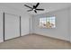 Bedroom features a modern ceiling fan, closet, and a window that offers natural light at 6255 Adenmoor Ct, Las Vegas, NV 89156