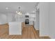 Bright kitchen featuring an island, stainless steel appliances, and white cabinetry with sleek hardware at 6255 Adenmoor Ct, Las Vegas, NV 89156