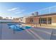 Backyard pool featuring clear water and a patio under a balcony at 6255 Adenmoor Ct, Las Vegas, NV 89156