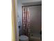 Bathroom with shower, toilet, and patterned curtain at 6256 Dayton Ave, Las Vegas, NV 89107