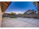 Backyard view showing patio, artificial turf, and block wall at 6584 Banbridge Dr, Las Vegas, NV 89103