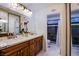 Bathroom with double vanity, granite countertop, and walk-in shower at 6584 Banbridge Dr, Las Vegas, NV 89103