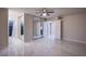 Bedroom with mirrored closet doors and tile flooring at 6584 Banbridge Dr, Las Vegas, NV 89103