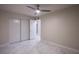 Bright bedroom with white tile floors and double doors to closet at 6584 Banbridge Dr, Las Vegas, NV 89103