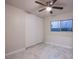 Bedroom with white sliding doors and tile flooring at 6584 Banbridge Dr, Las Vegas, NV 89103