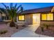 Front entrance of the house with a walkway and landscaping at 6584 Banbridge Dr, Las Vegas, NV 89103