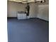 Garage with grey epoxy flooring, washer, and dryer hookups at 6584 Banbridge Dr, Las Vegas, NV 89103