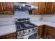 Stainless steel range and range hood in a modern kitchen at 6584 Banbridge Dr, Las Vegas, NV 89103