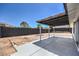 Covered patio and spacious backyard with a fire pit at 7205 Carrondale Way, Las Vegas, NV 89128