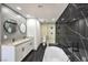 Modern bathroom with double vanity and large shower at 7205 Carrondale Way, Las Vegas, NV 89128