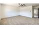 Bright bedroom with ceiling fan and carpet flooring at 7205 Carrondale Way, Las Vegas, NV 89128